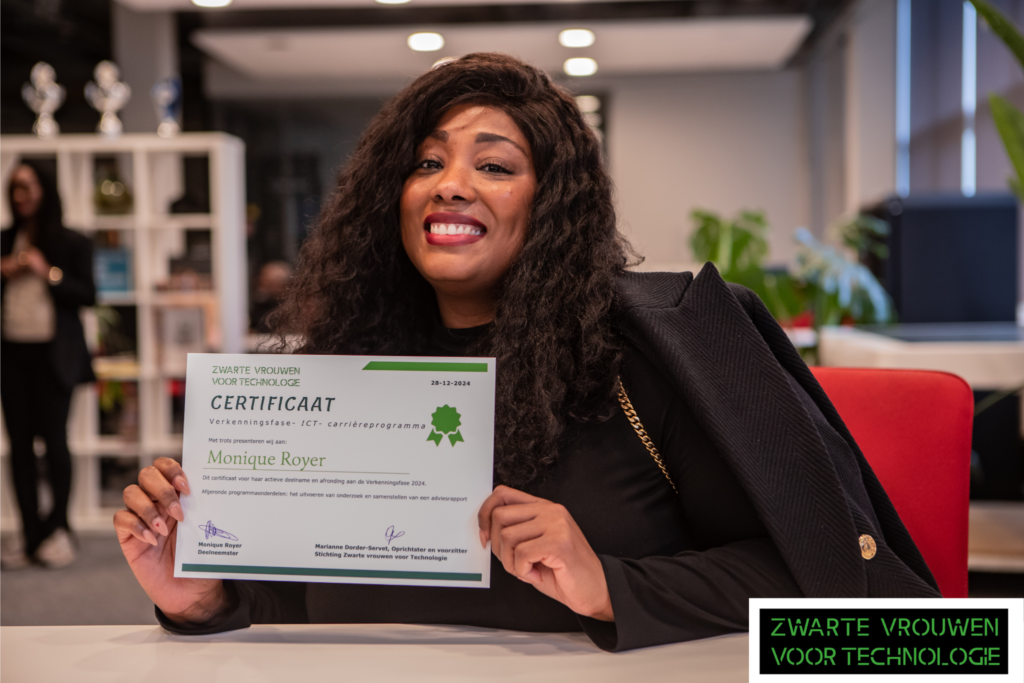 Picture of Monique Royer who is holding a ZVVT certificate